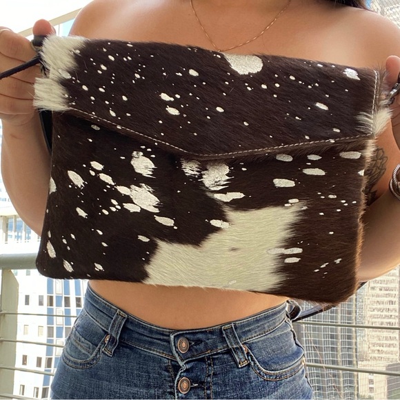 Handbags - Cowhide clutch with a crossbody strap